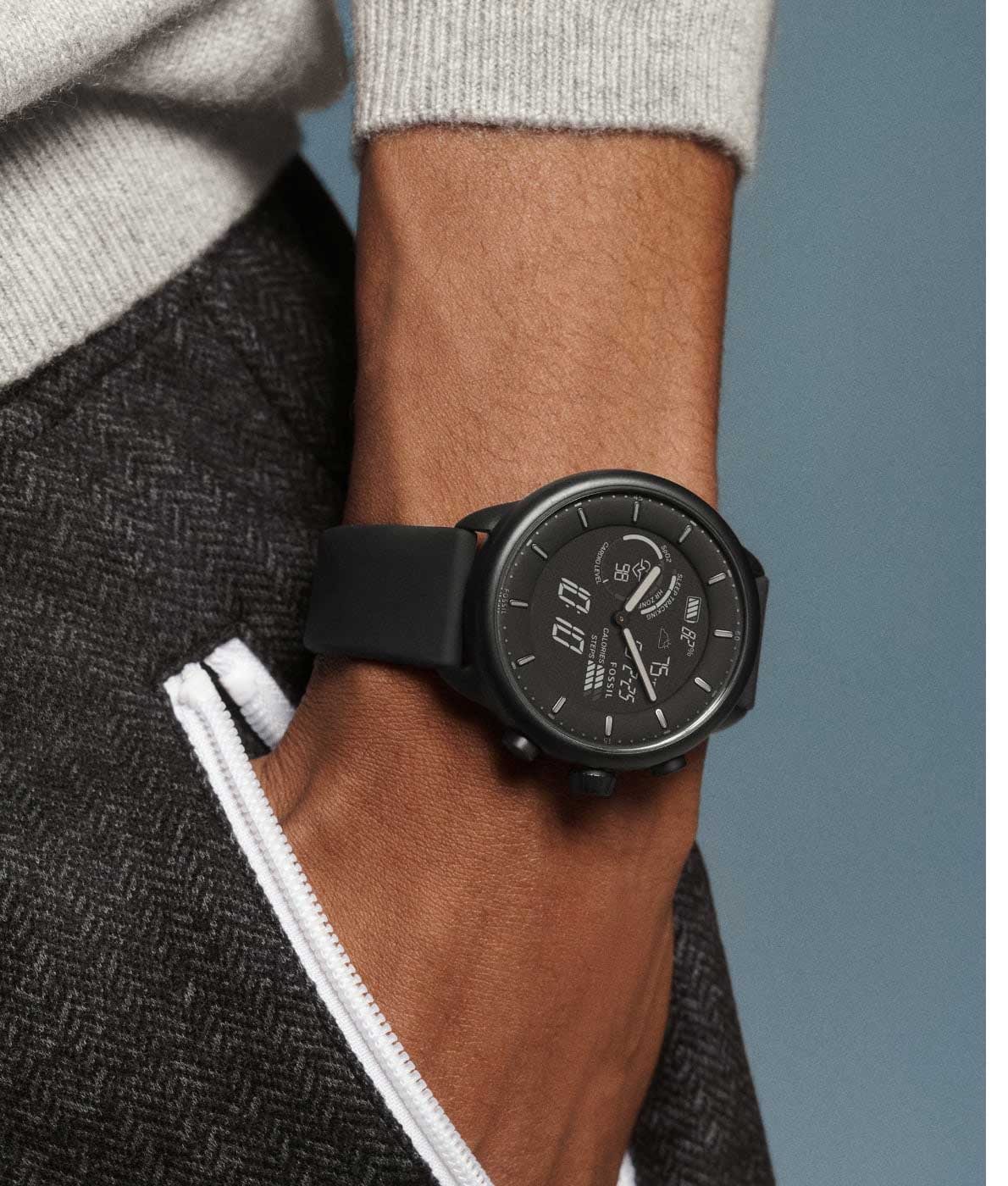 A man with his hand in his pocket wearing a black Gen 6 Hybrid Wellness Edition.