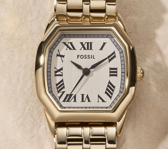 A gold-tone Harlow watch with white dial.